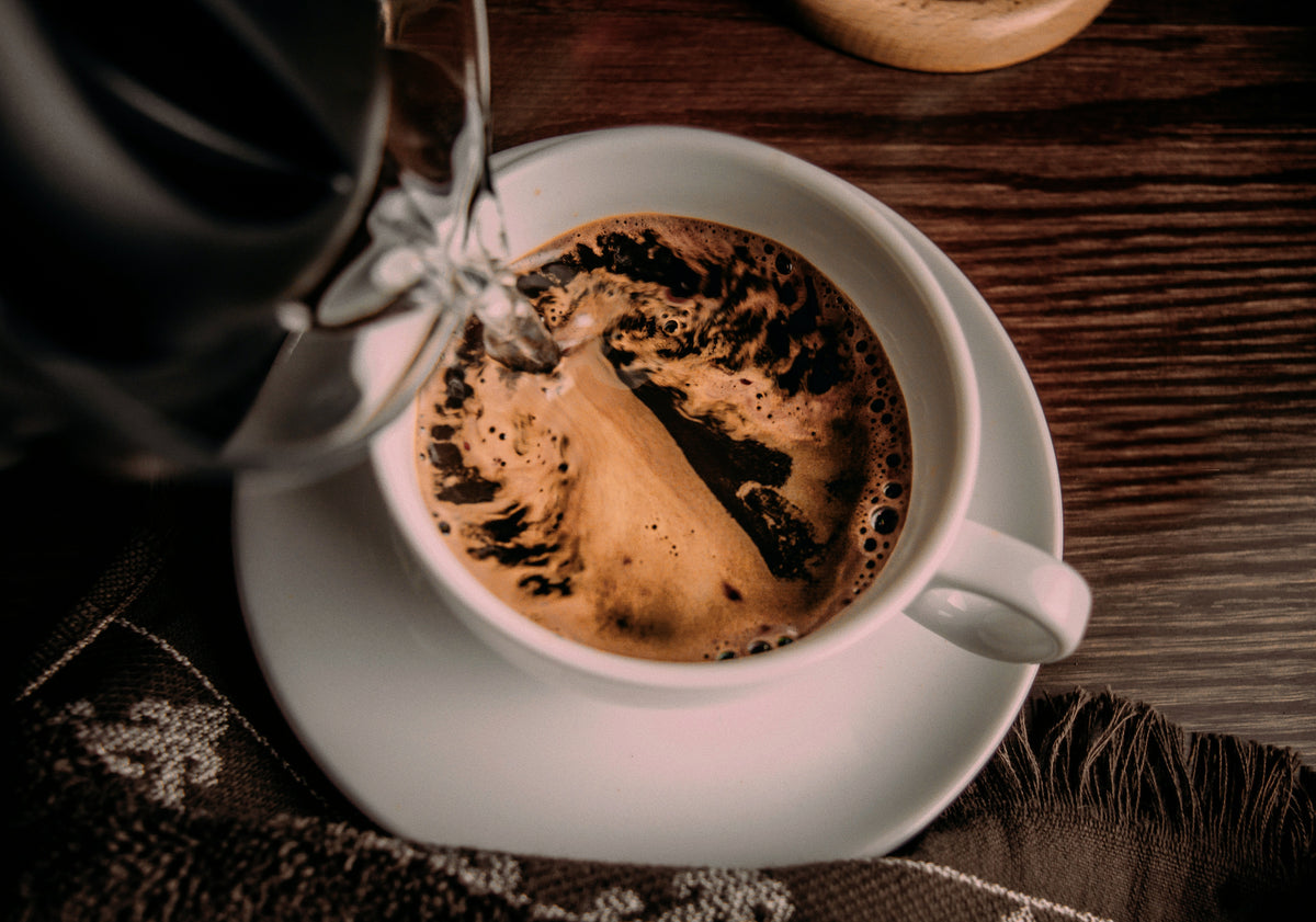 Pour hot water into the pod → one clean black coffee. Add a splash of hot water (6 oz).